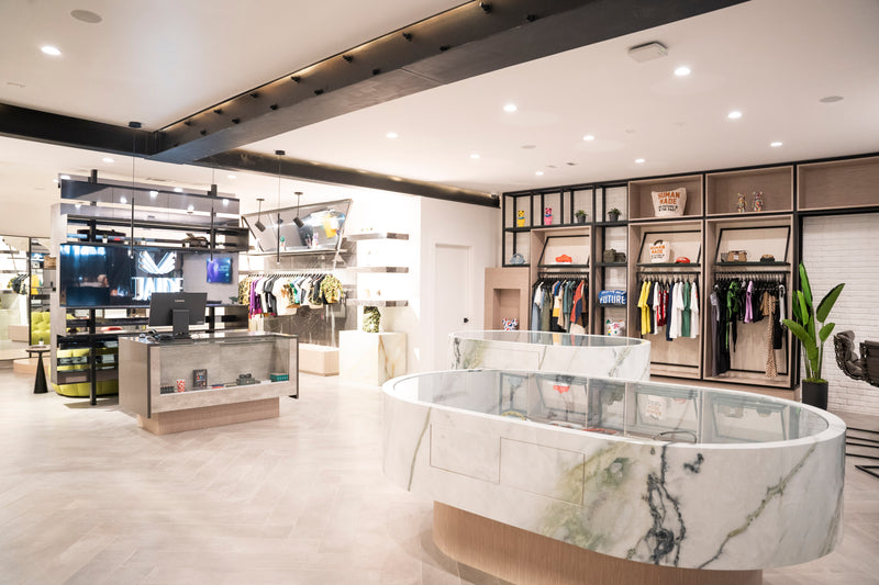 JAIDE Atlanta merchandised interior with marble display cases and cash wrap.